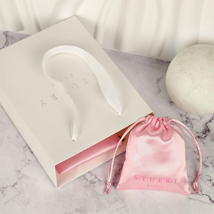 Paper shopping bags with custom logos and luxury twisted handles