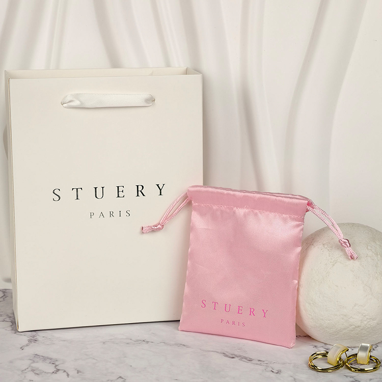 Paper shopping bags with custom logos and luxury twisted handles