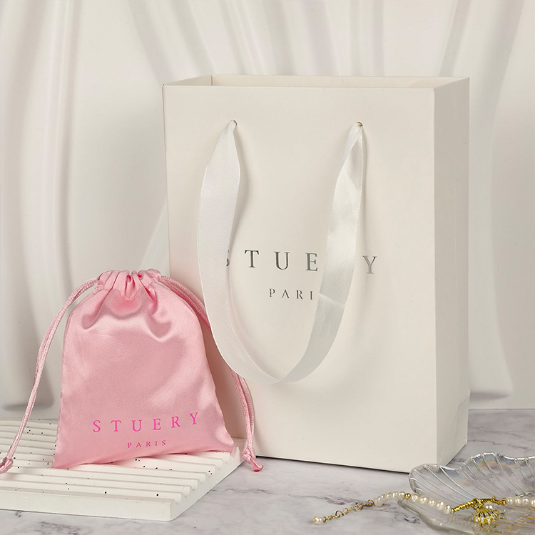 Paper shopping bags with custom logos and luxury twisted handles