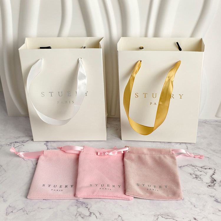 Paper shopping bags with custom logos and luxury twisted handles